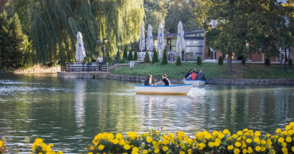 People in boats in the city lake